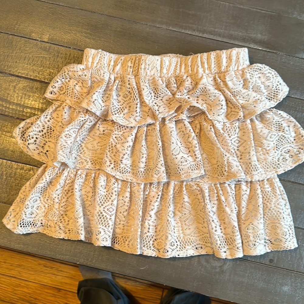 This cute skirt is from Brat star, size medium, three layered beige skirt